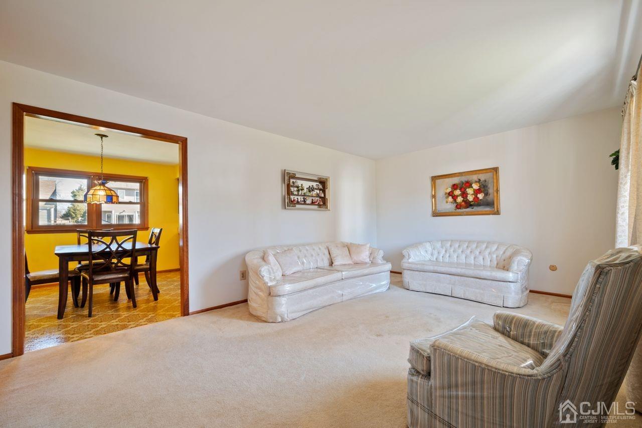 300 Main Street Middlesex, NJ 08846 - Photo 4 of 17 a living room with furniture and a table