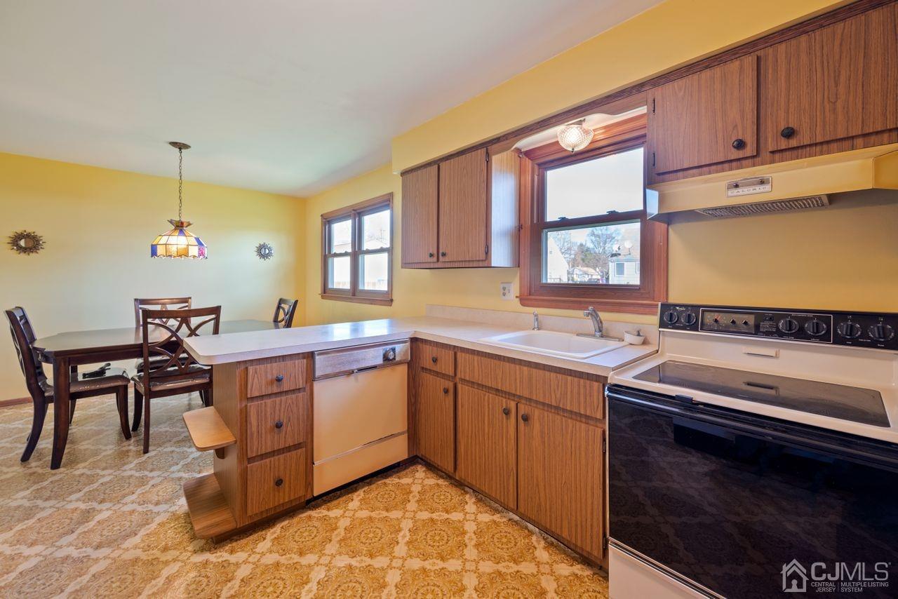 300 Main Street Middlesex, NJ 08846 - Photo 6 of 17 a kitchen with a sink cabinets and window