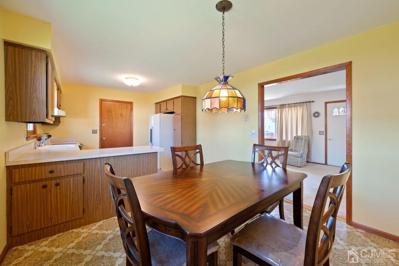 300 Main Street Middlesex, NJ 08846 - Photo 8 of 17 a view of a dining room and a table and chairs