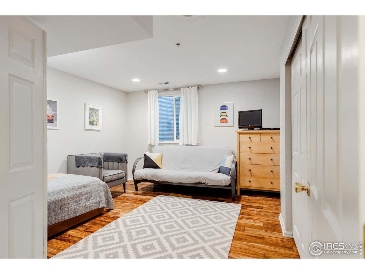 3739 Ridgeway Street Boulder, CO 80301 - Photo 14 of 16 a bedroom with furniture and a wooden floor