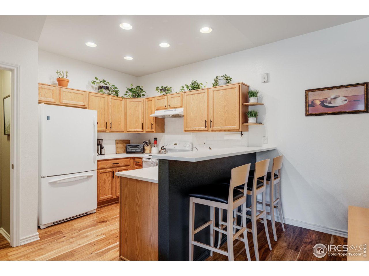3739 Ridgeway Street Boulder, CO 80301 - Photo 4 of 16 a kitchen with stainless steel appliances a refrigerator and a stove top oven