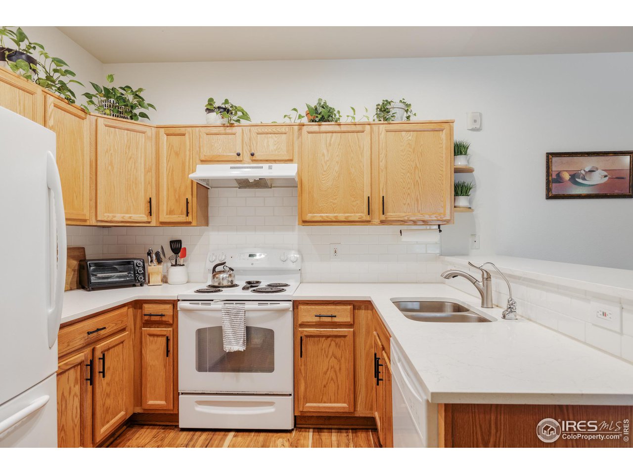 3739 Ridgeway Street Boulder, CO 80301 - Photo 5 of 16 a kitchen with stainless steel appliances granite countertop a sink stove and cabinets
