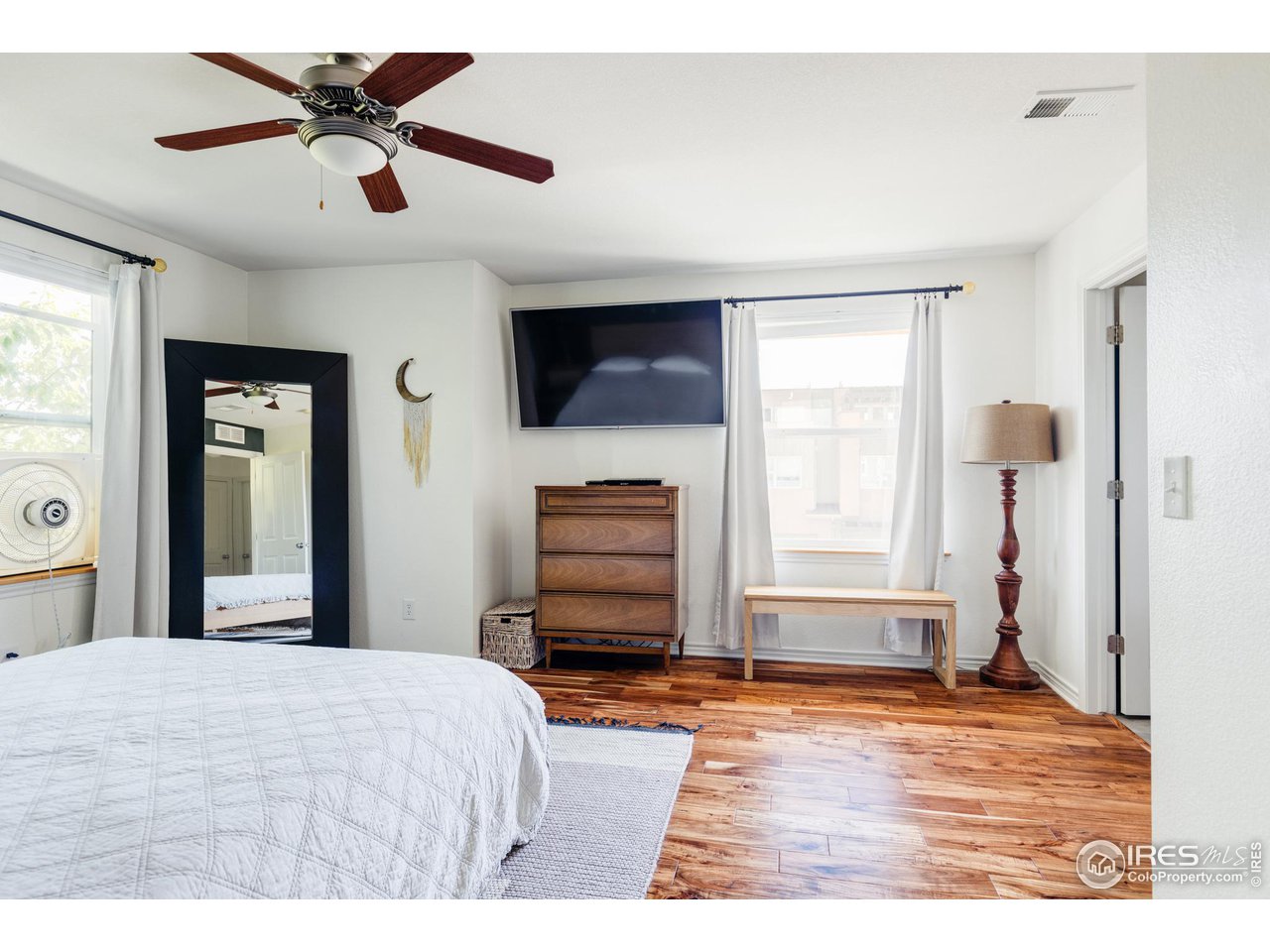 3739 Ridgeway Street Boulder, CO 80301 - Photo 7 of 16 a bedroom with a bed and a flat screen tv