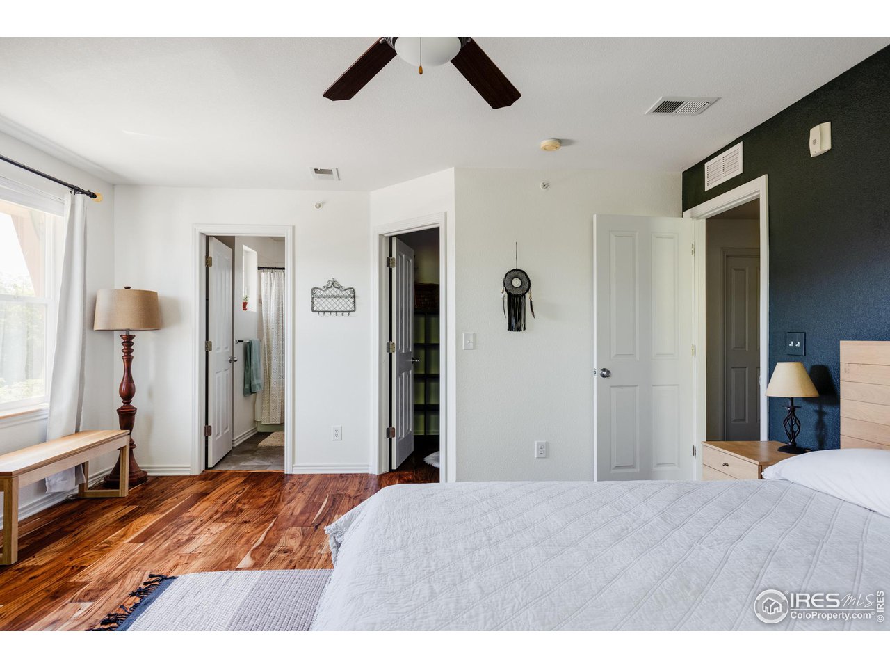 3739 Ridgeway Street Boulder, CO 80301 - Photo 8 of 16 a bedroom with a bed and a large mirror on the dresser