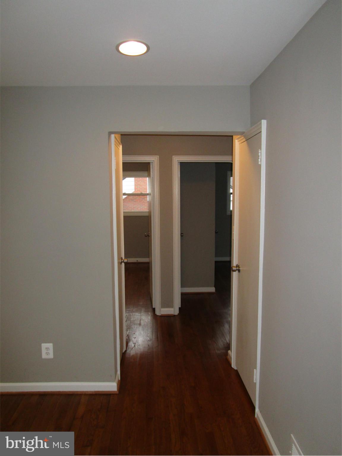 12704 Holdridge Road Silver Spring, MD 20906 - Photo 6 of 22 wooden floor in a hallway