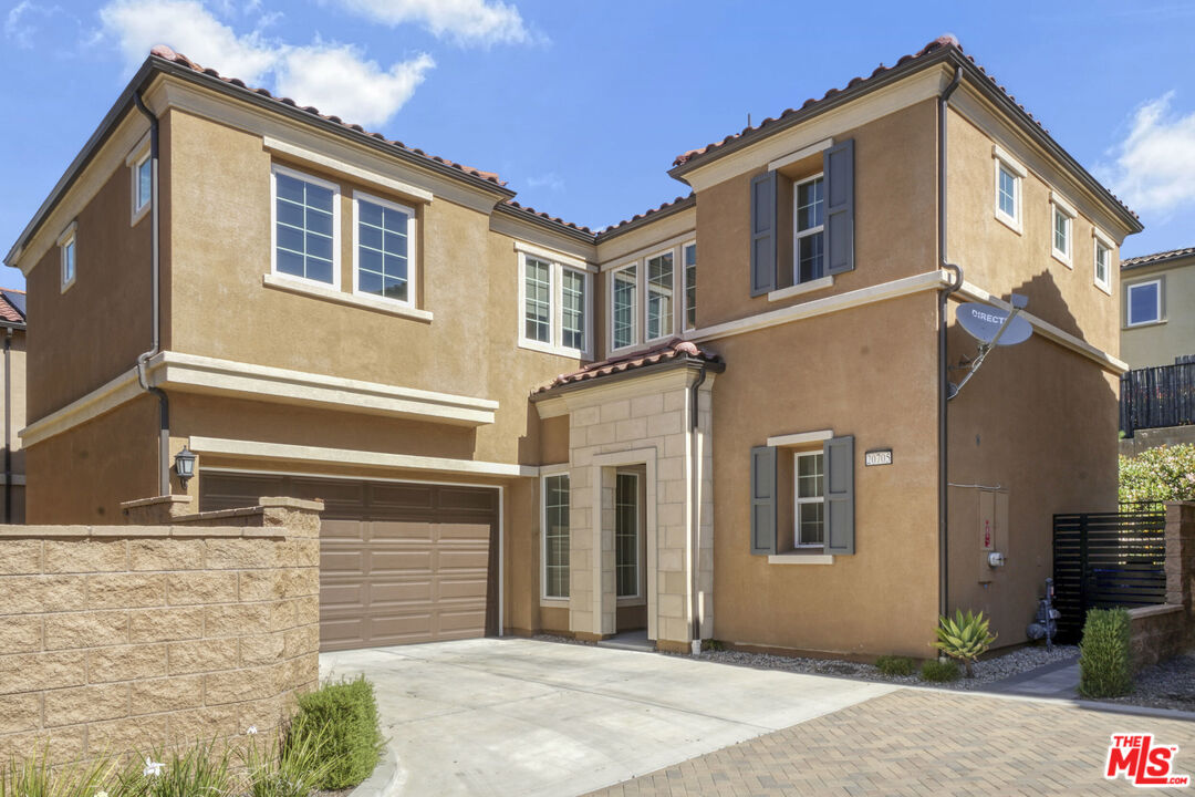 a front view of a house with a garage