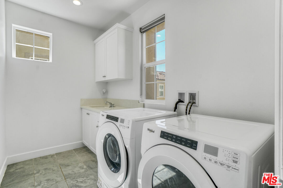 20705 West Chestnut Circle Porter Ranch, CA 91326 - Photo 18 of 35 a utility room with dryer and washer