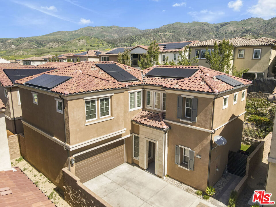 20705 West Chestnut Circle Porter Ranch, CA 91326 - Photo 2 of 35 a view of a house with a terrace