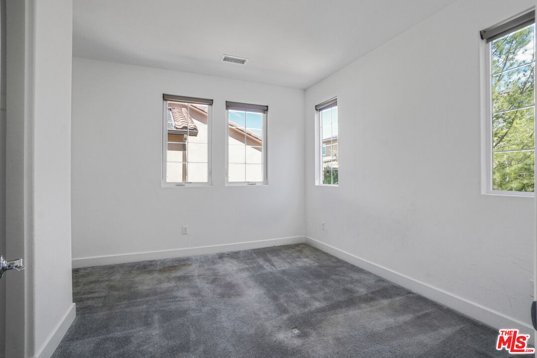 20705 West Chestnut Circle Porter Ranch, CA 91326 - Photo 26 of 35 an empty room with windows