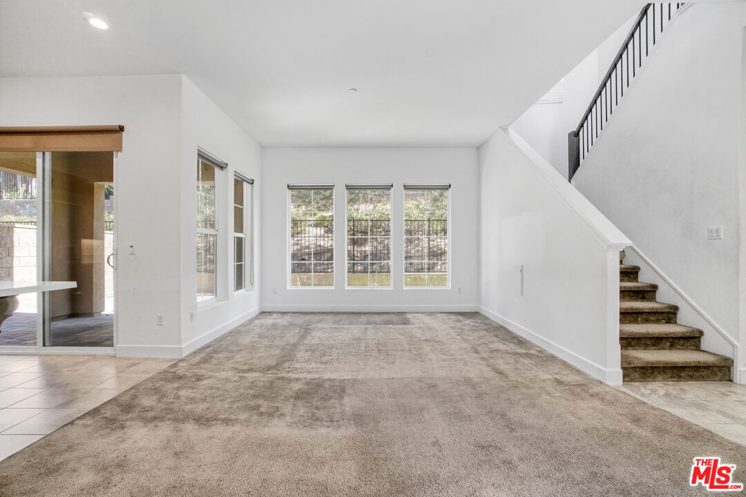 20705 West Chestnut Circle Porter Ranch, CA 91326 - Photo 7 of 35 wooden floor in an empty room with a window