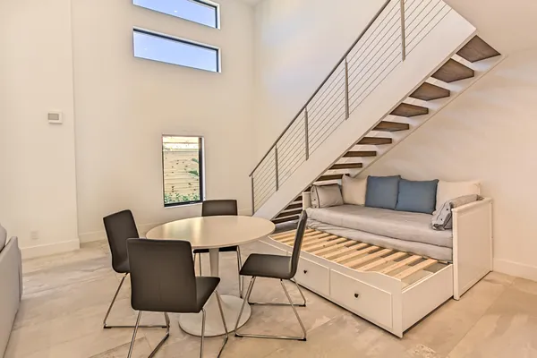 a view of entryway dining room and hall with wooden floor