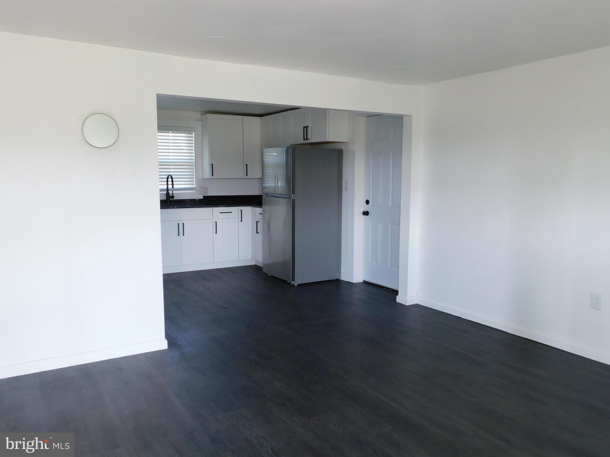 398 Shady Grove Lane Charles Town, WV 25414 - Photo 7 of 25 Living Room to Kitchen