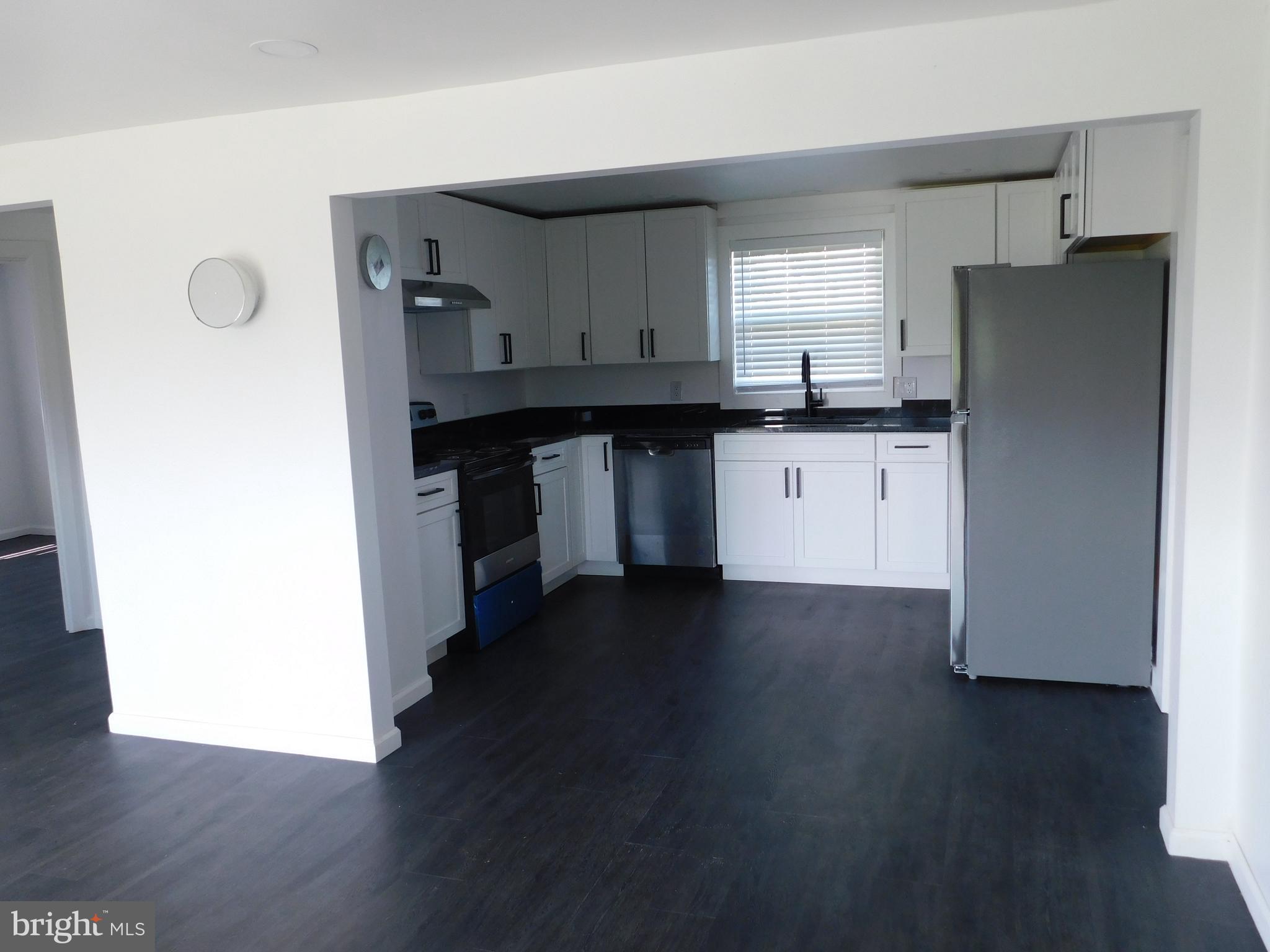 398 Shady Grove Lane Charles Town, WV 25414 - Photo 9 of 25 Living Room to Kitchen