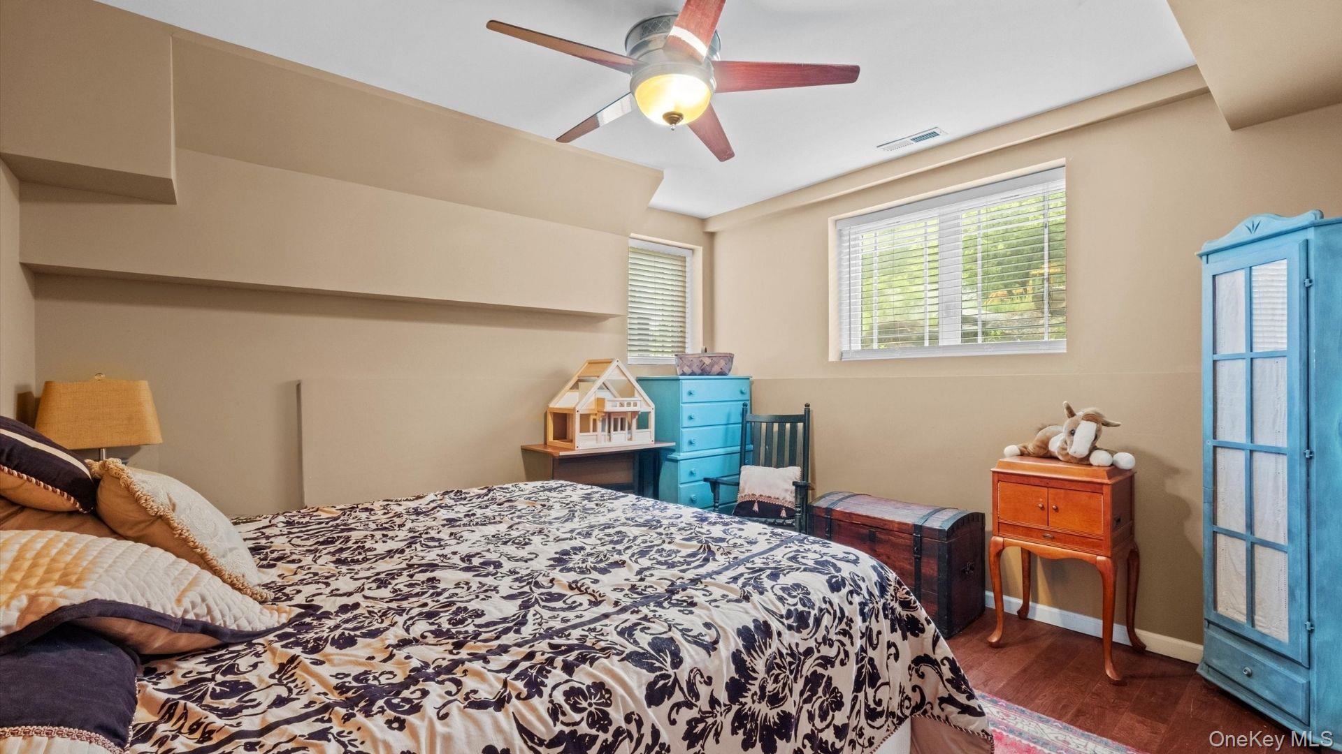 42 Blackstone Ridge Holmes, NY 12531 - Photo 13 of 43 a bedroom with a bed and a chandelier