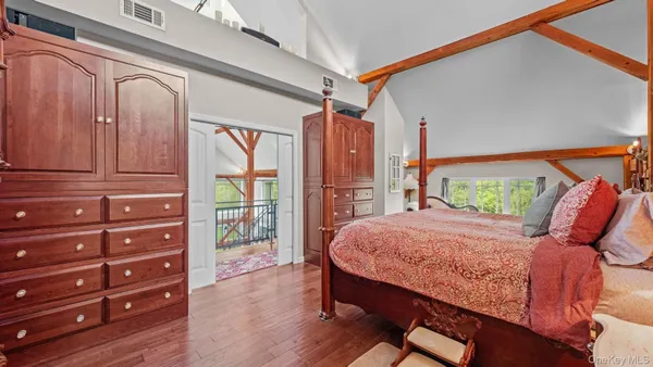 a bed room with a bed and a window