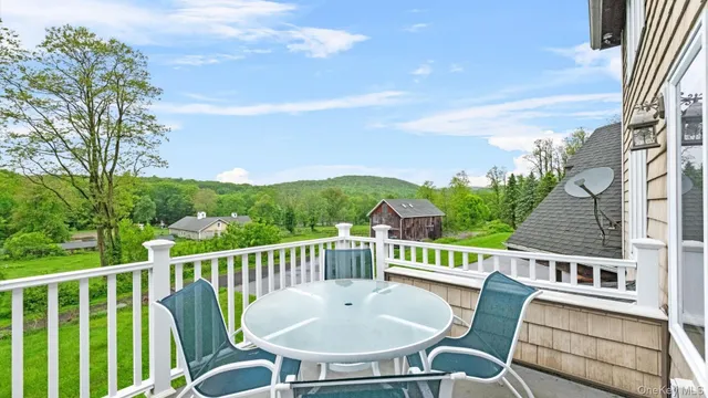a view of a chairs and table on the terrace