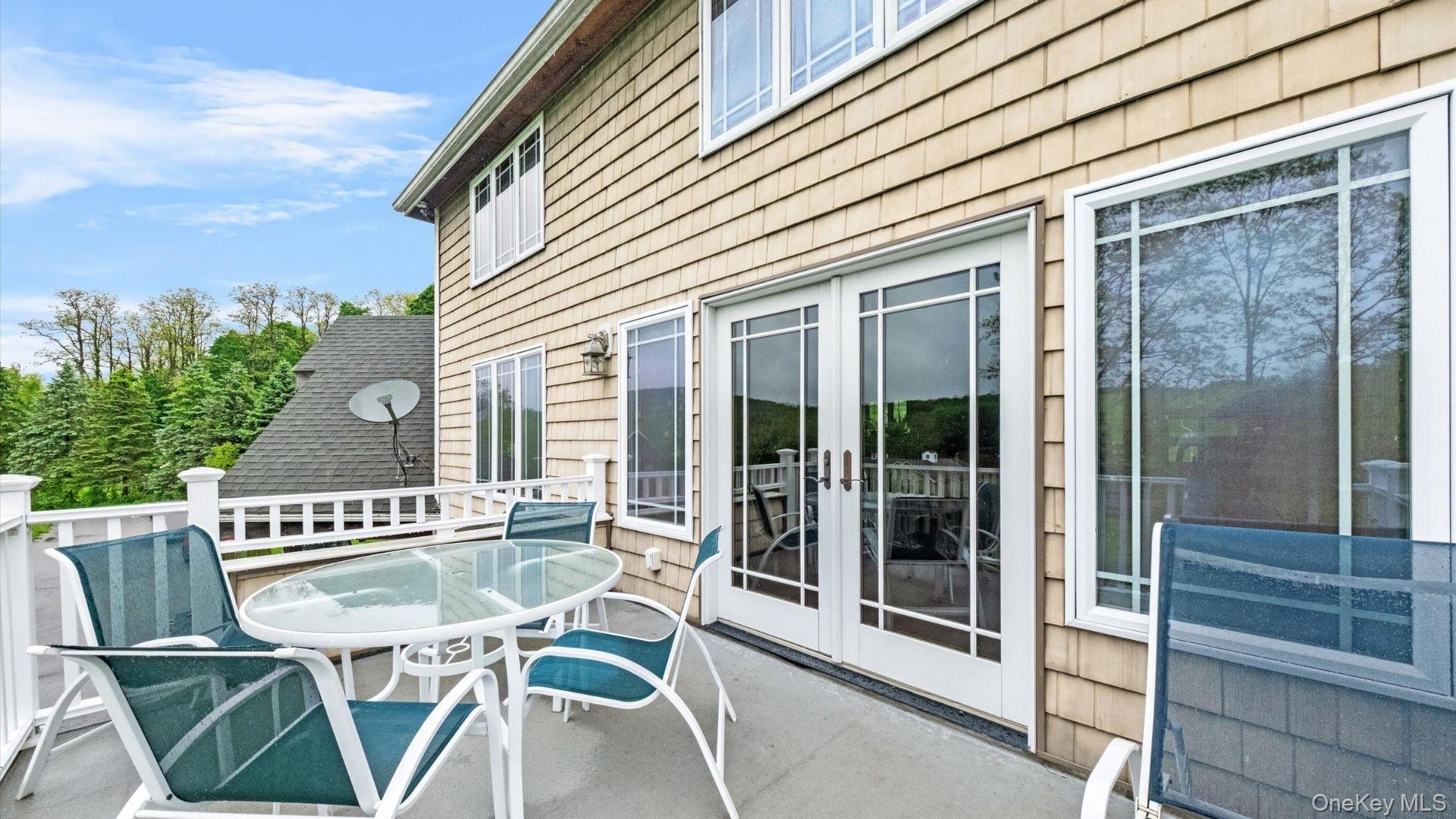 42 Blackstone Ridge Holmes, NY 12531 - Photo 35 of 43 a view of a patio with table and chairs and potted plants