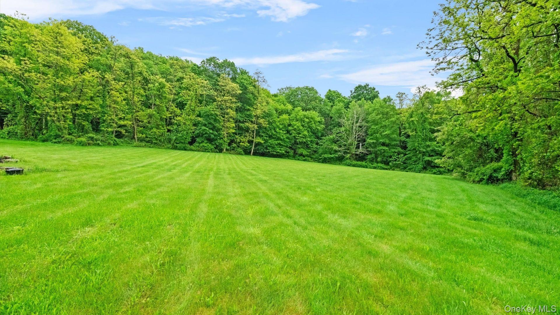 42 Blackstone Ridge Holmes, NY 12531 - Photo 37 of 43 a view of a garden with plants and a bench