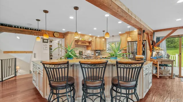 a view of a dining room with furniture wooden floor and chandelier