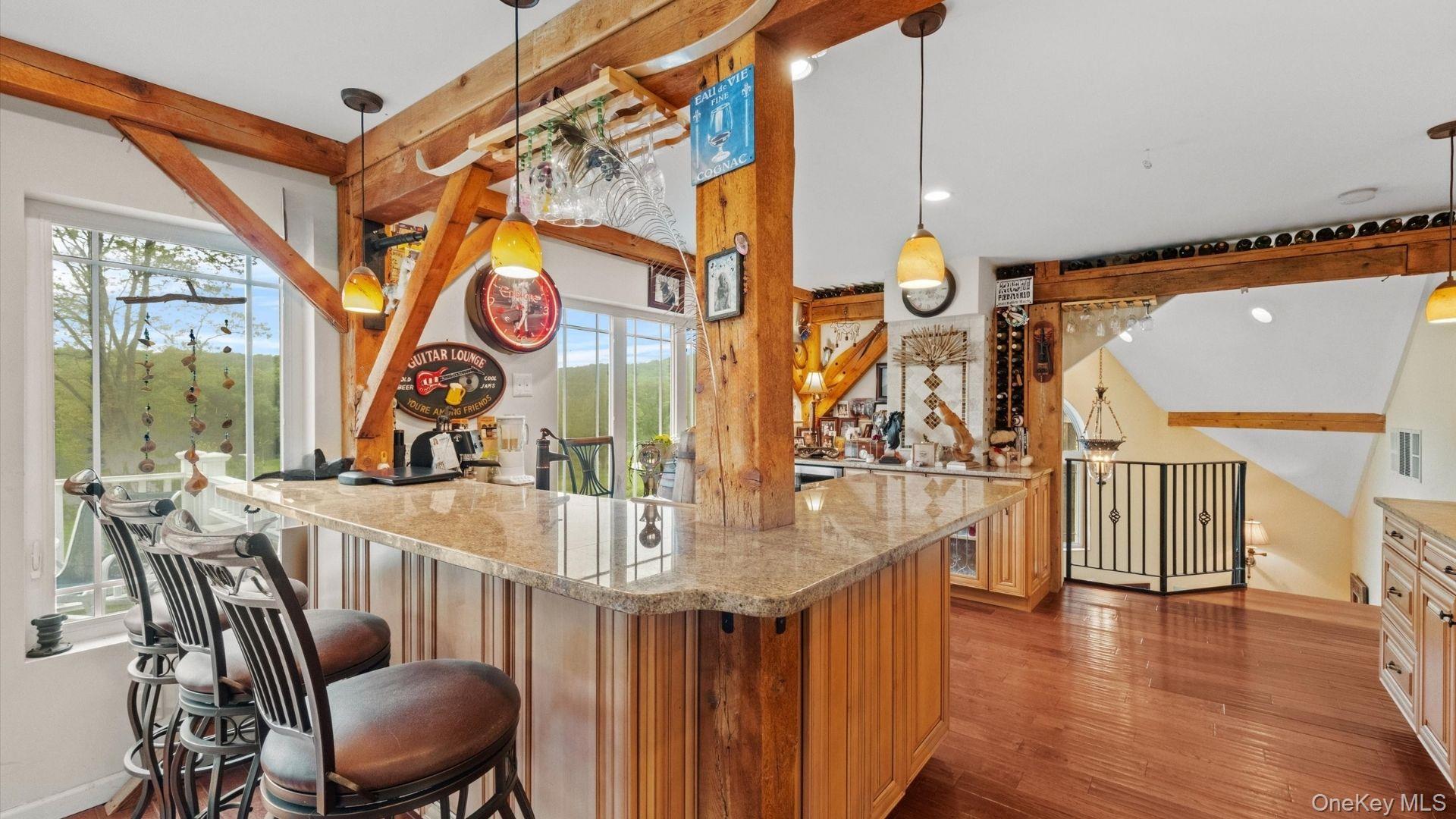 42 Blackstone Ridge Holmes, NY 12531 - Photo 8 of 43 a dining room with large window and wooden floor