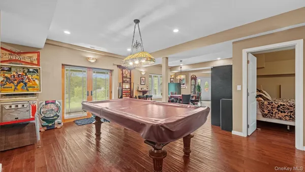 a dining table with chairs and wooden floor