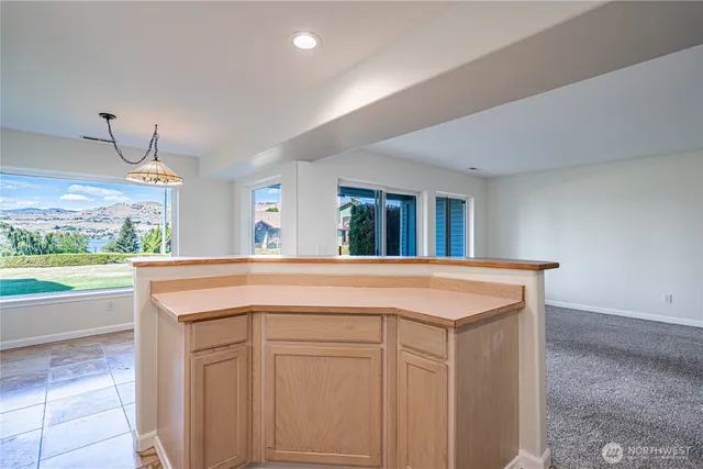 a view of kitchen with furniture and counter space
