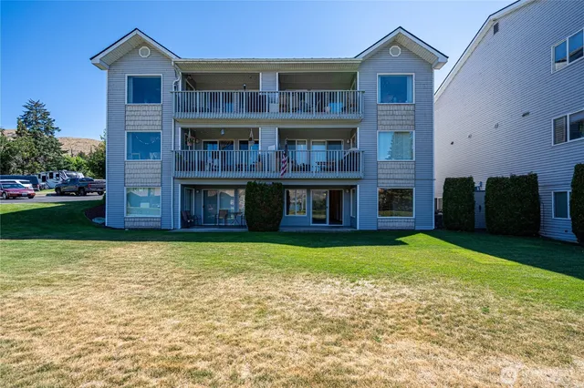 a view of a house with a yard and a fireplace