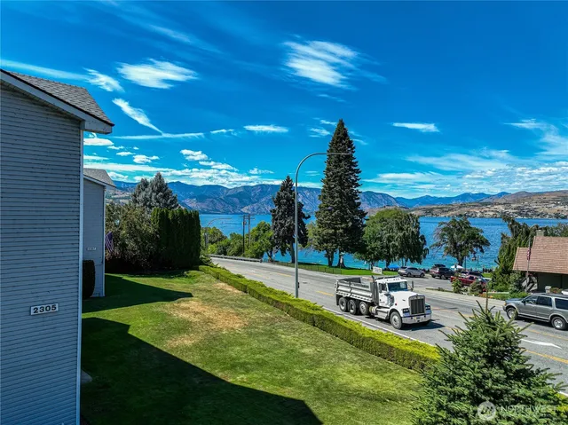 a view of a terrace with chairs and a table