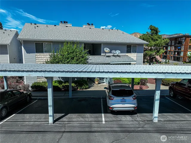 a front view of a house with parking space