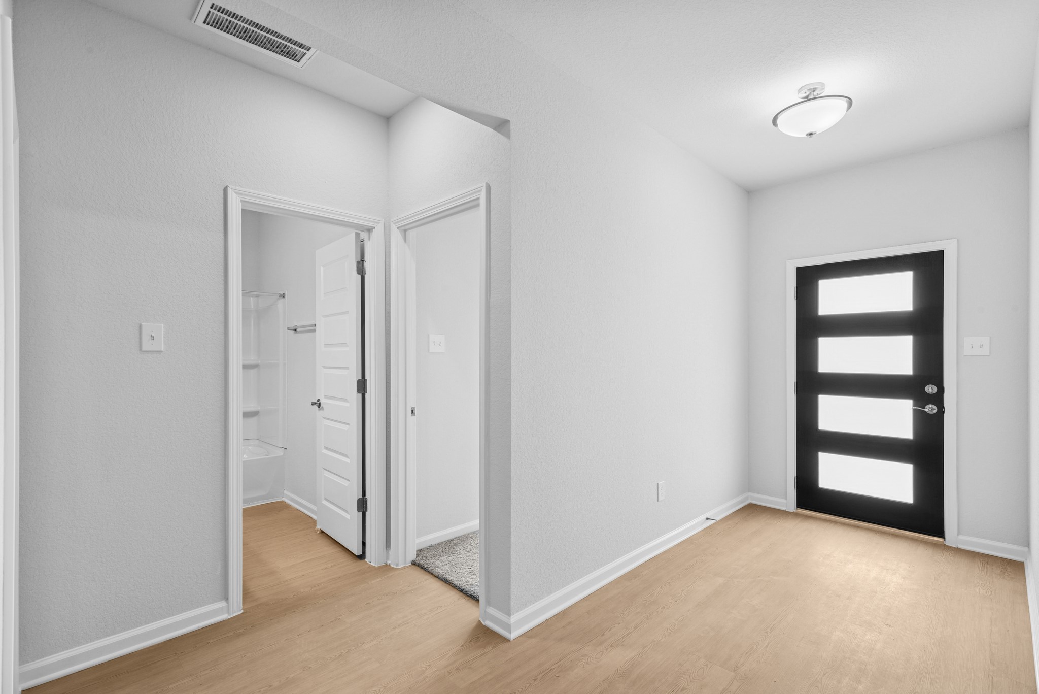 9742 Enclave Ridge Road Willis, TX 77318 - Photo 2 of 24 The Pearson- Foyer into Secondary Bath and Bedrooms