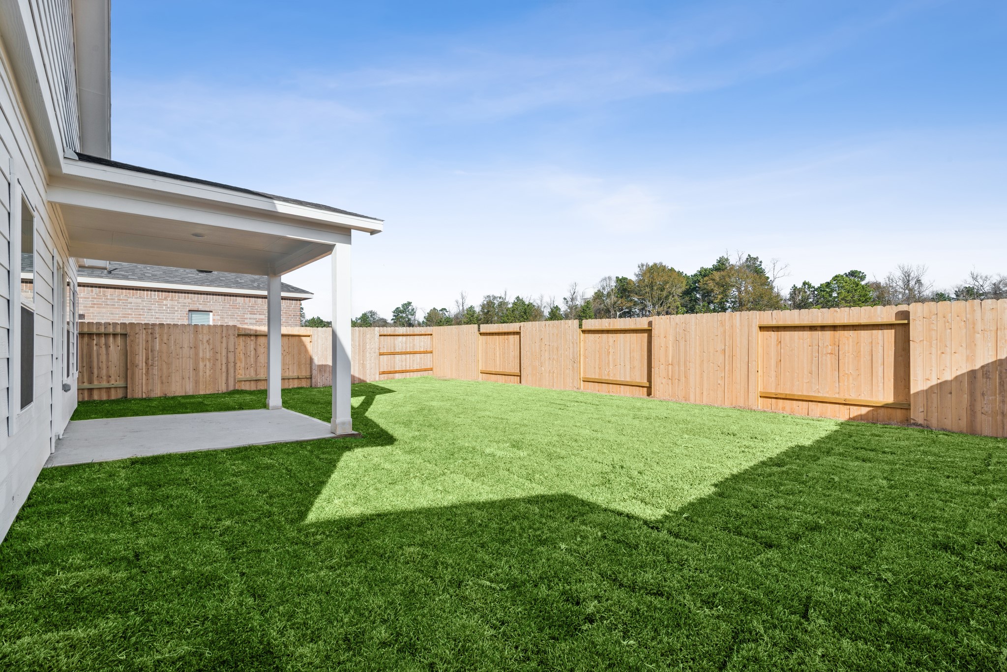 9742 Enclave Ridge Road Willis, TX 77318 - Photo 22 of 24 The Pearson- Rear Yard and Covered Patio