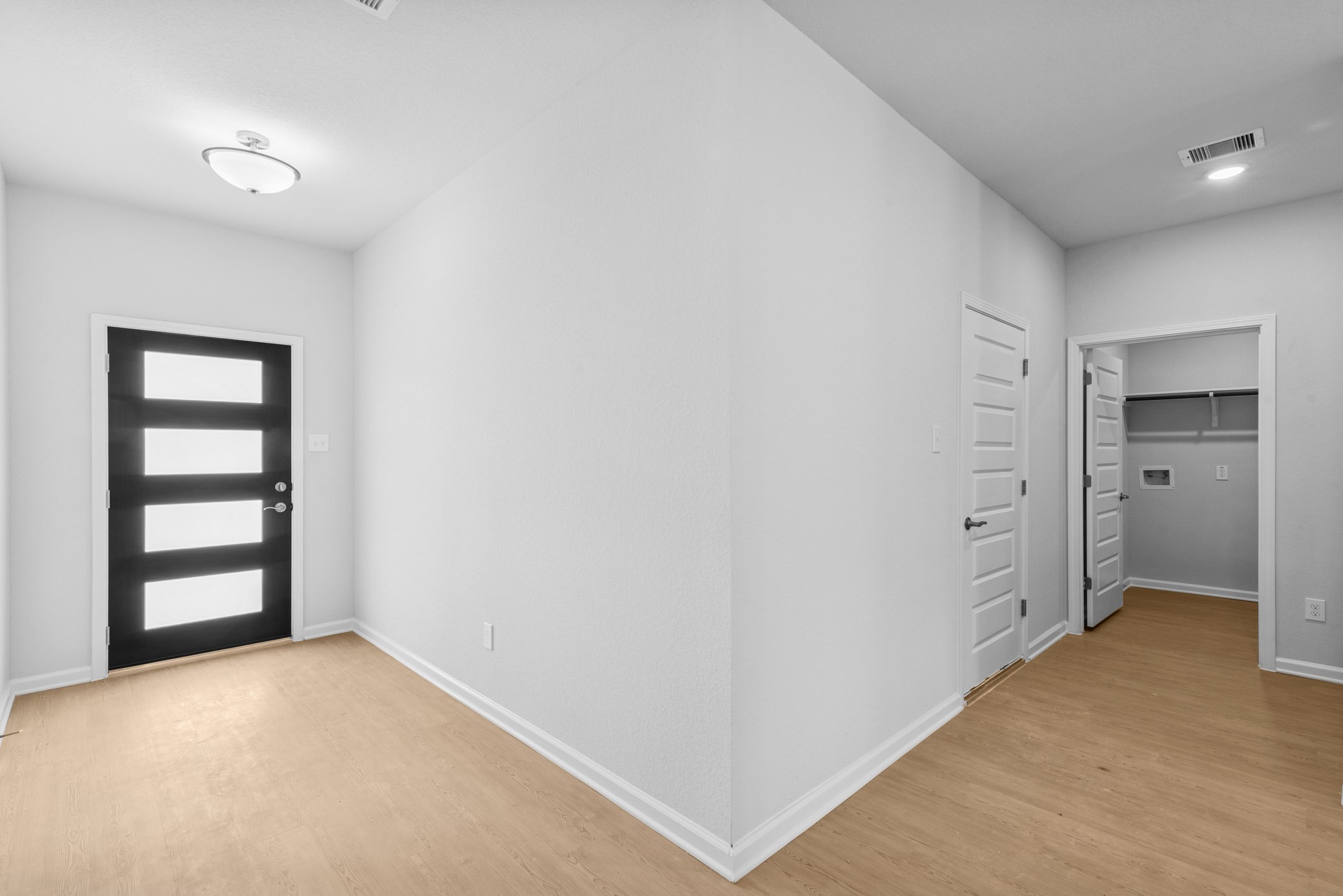 9742 Enclave Ridge Road Willis, TX 77318 - Photo 3 of 24 The Pearson- Foyer into Utility Room