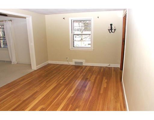 265 Hudson Road Sudbury, MA 01776 - Photo 3 of 10 a view of a room with wooden floor and white walls
