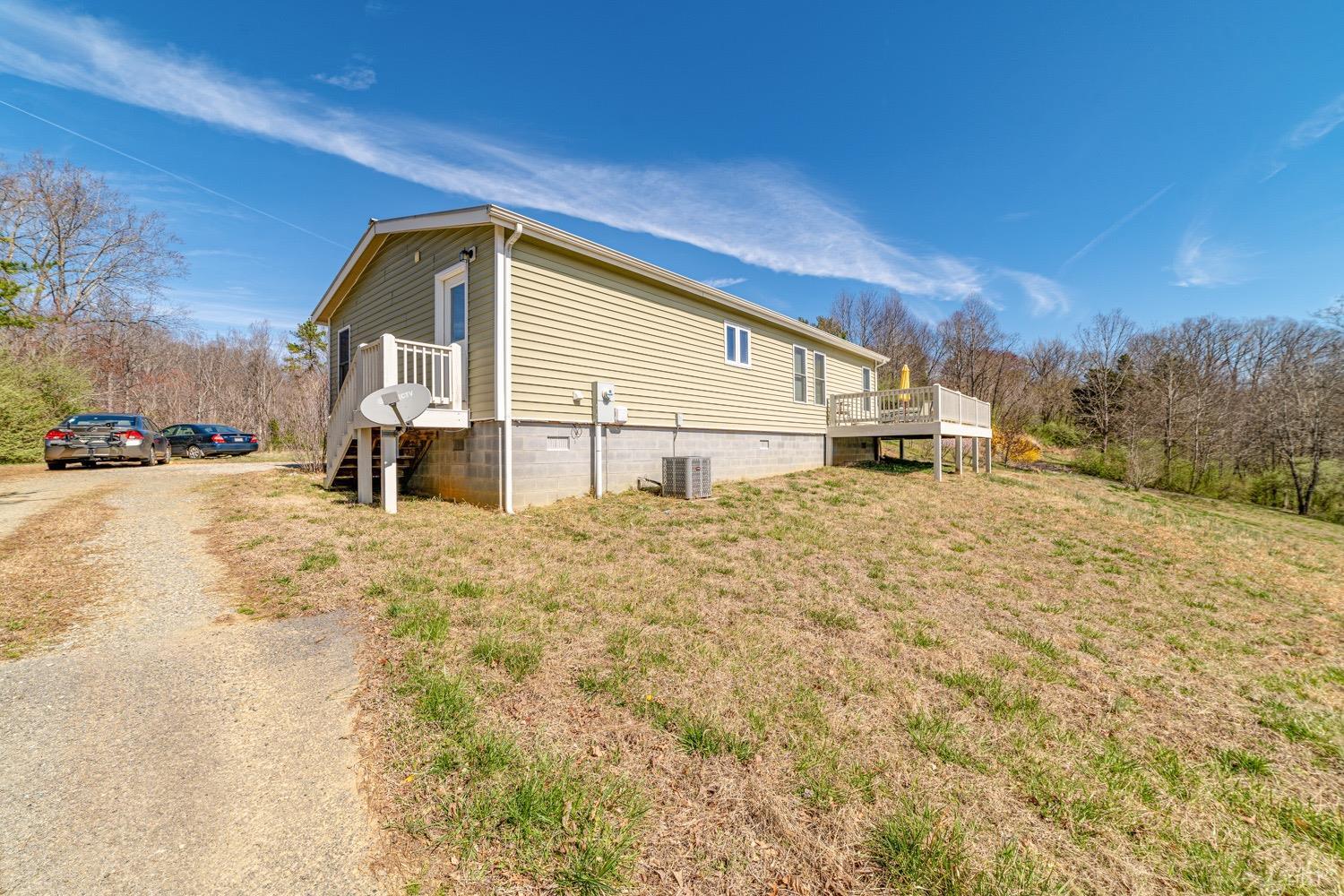 1377 Stripers Cove Road Goodview, VA 24095 - Photo 23 of 36 a view of a house with a yard