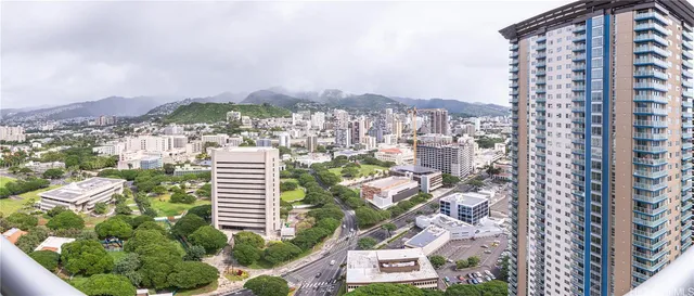 a view of city and green space