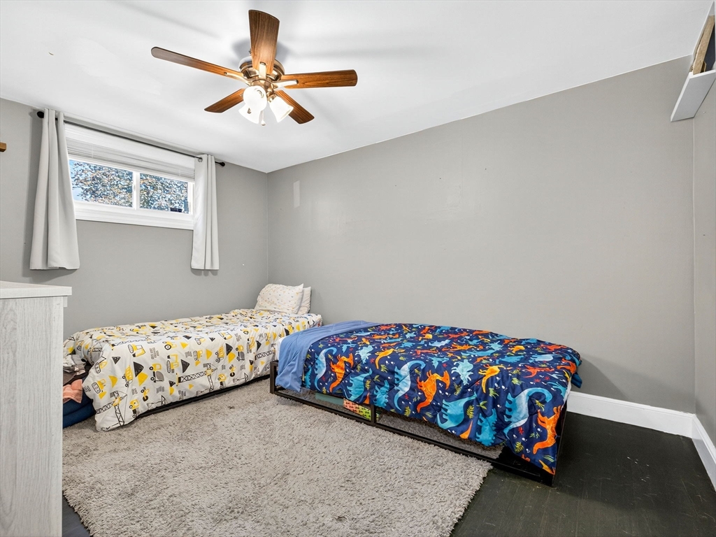31 Tingley Road Braintree, MA 02184 - Photo 15 of 30 a bedroom with bed and a chandelier
