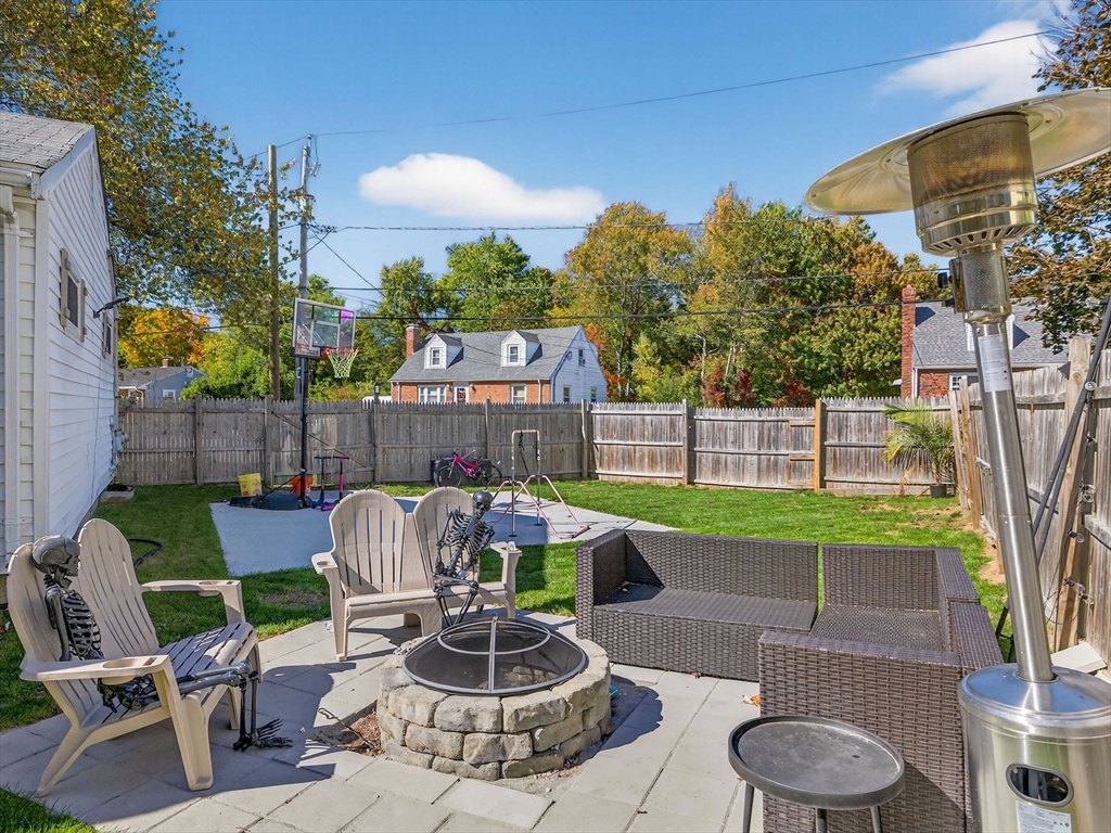 31 Tingley Road Braintree, MA 02184 - Photo 25 of 30 a patio with a table and chairs