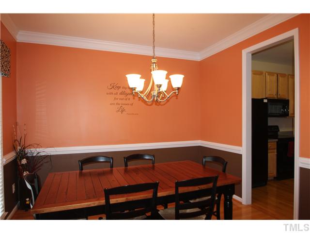 5105 Long Neck Court Raleigh, NC 27604 - Photo 4 of 22 Dining room with hardwood floors, chair rail and crown molding