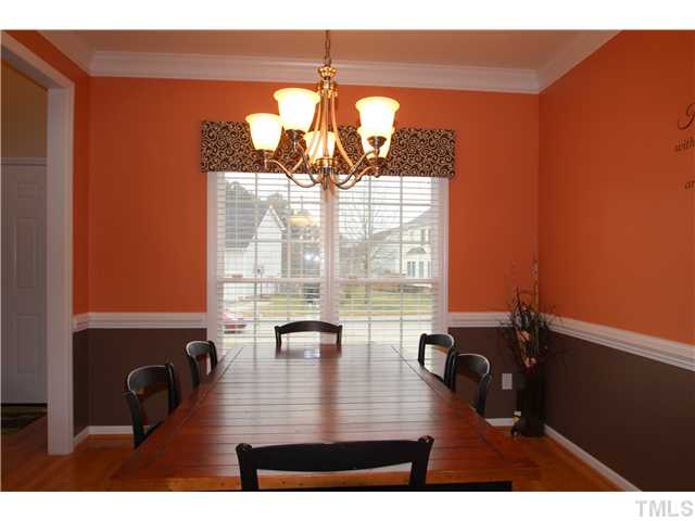 5105 Long Neck Court Raleigh, NC 27604 - Photo 8 of 22 Dining room with hardwood floors, chair rail and crown molding