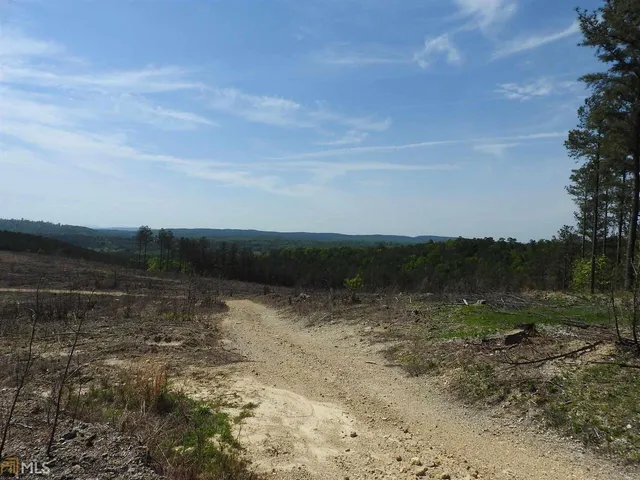 a view of lake with mountain in background