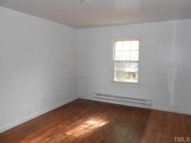 520 Steel Street Raleigh, NC 27603 - Photo 3 of 9 an empty room with a window