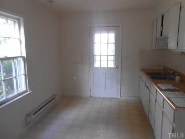520 Steel Street Raleigh, NC 27603 - Photo 5 of 9 an empty room with windows