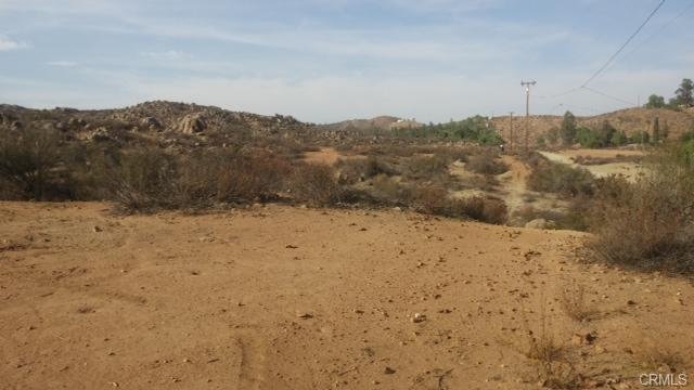 10 On Post Road Perris, CA 92570 - Photo 2 of 10 a view of a dry yard covered with snow