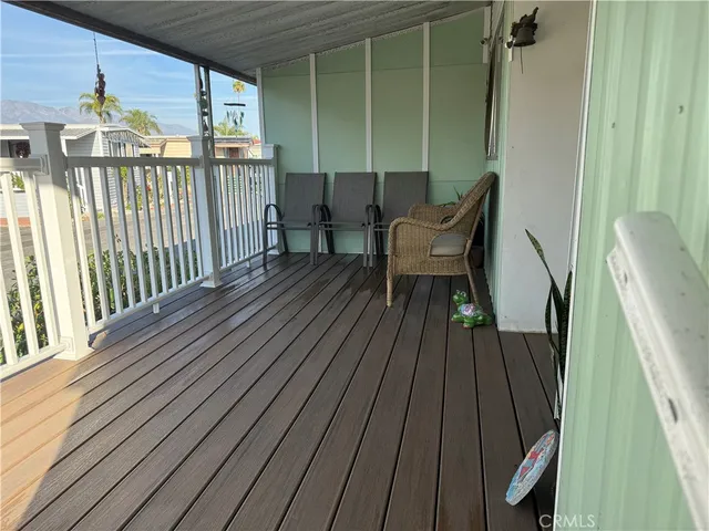 a view of balcony with wooden floor