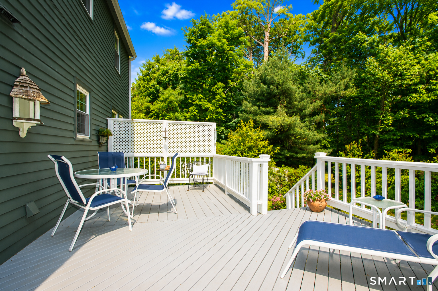 49 Hammonassett Meadows Road Madison, CT 06443 - Photo 9 of 31 Large deck off of the sunroom overlooks the beautiful and private backyard.