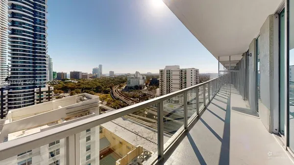 a city view from a balcony with city view