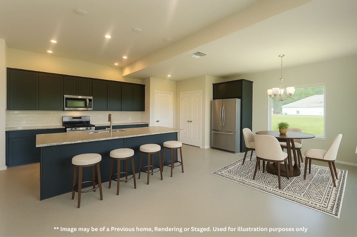 8 Greenway Drive Trinity, TX 75862 - Photo 4 of 13 a kitchen with a dining table chairs and refrigerator