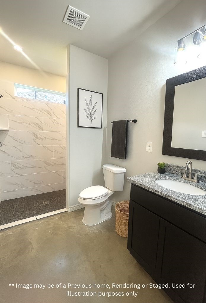 8 Greenway Drive Trinity, TX 75862 - Photo 7 of 13 a bathroom with a toilet sink vanity and mirror