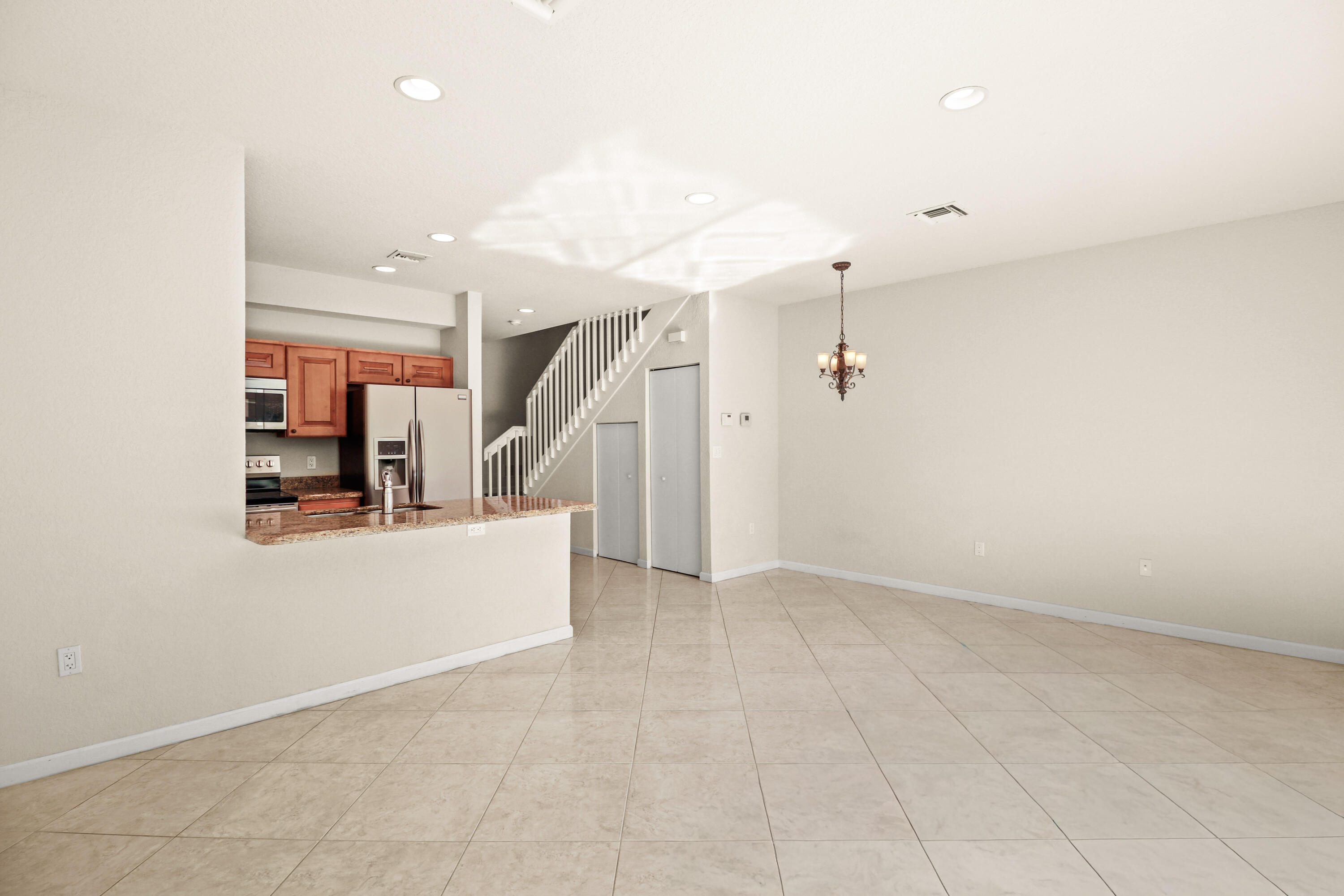 37 Southeast 3rd Avenue Hallandale Beach, FL 33009 - Photo 17 of 47 an entryway in a hall with a window