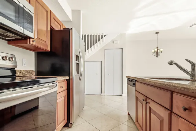 a kitchen with a stove and a sink